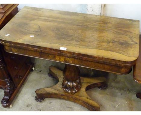 A William IV rosewood fold over card table, of rectangular form, raised on a centre column, and platform base, width 92cm