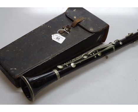 A Vintage rosewood and nickel plate clarinet, stamped VKS, original leather case