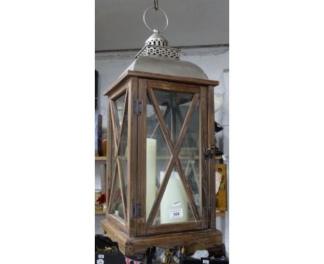 A large pine-cased candle lantern