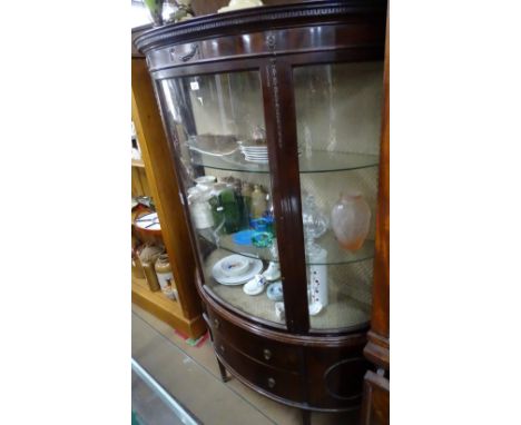 An Edwardian mahogany 2-section bow-front display cabinet, base fitted with drawers and cupboards, raised on square tapered l