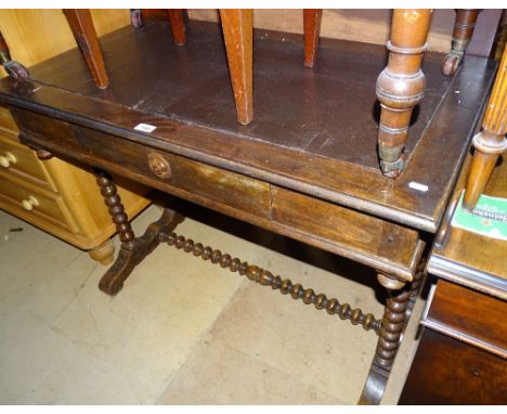 An Antique oak stretcher table with single drawer, and bobbin turned supports, width 102cm
