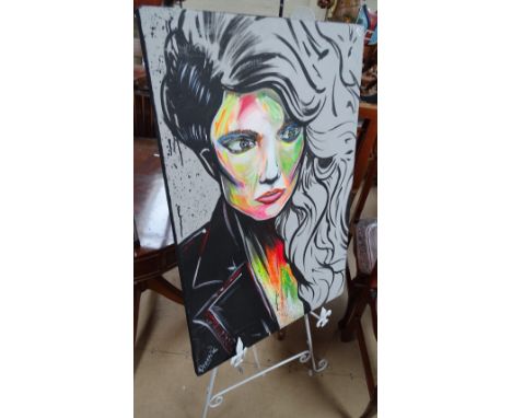 A metal folding artist's easel, together with an oil on canvas portrait study