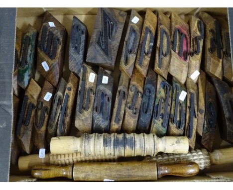 A collection of Vintage wood printing blocks, and 4 wood printing rollers