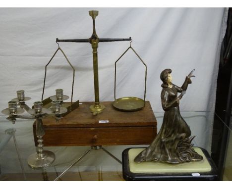 A cased pair of brass balance scales, a plated candelabra, and a spelter figure on slate base (3)