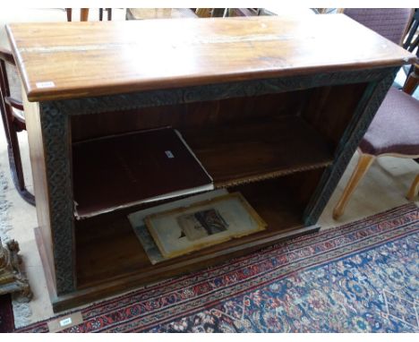 A carved teak Almirah open bookcase, with single shelf, length 128cm, height 95cm, depth 38cm