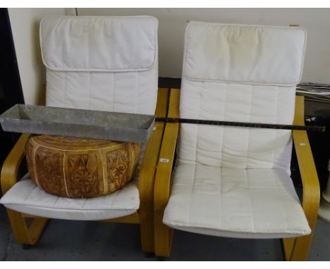 A pair of Ikea Poang chairs and a Moorish design leather pouffe