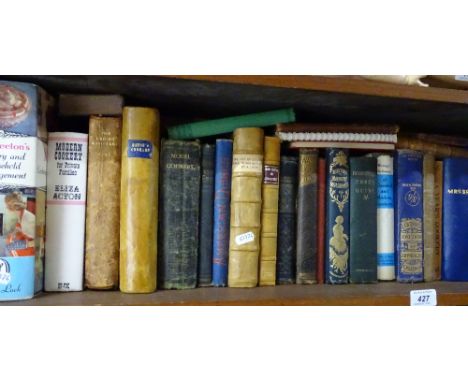 A shelf of cookery books including leather-bound