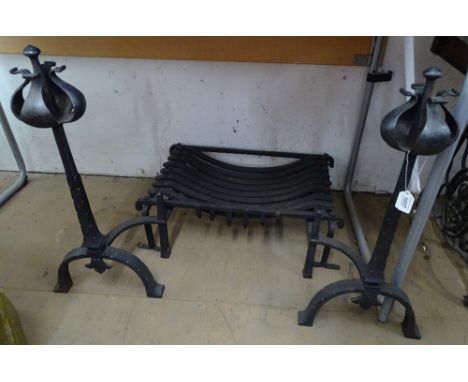 A cast-iron ducks nest fire grate, and a pair of stylised fire dogs