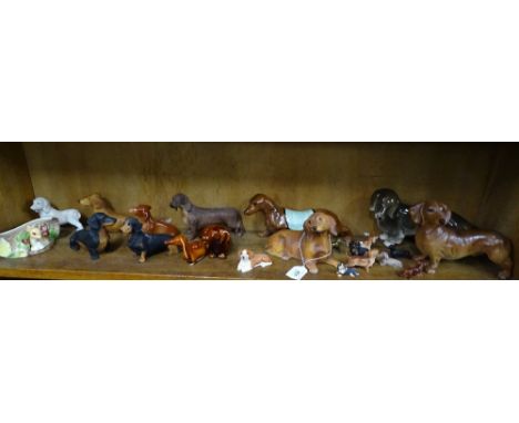 A shelf of Dachshund figures etc