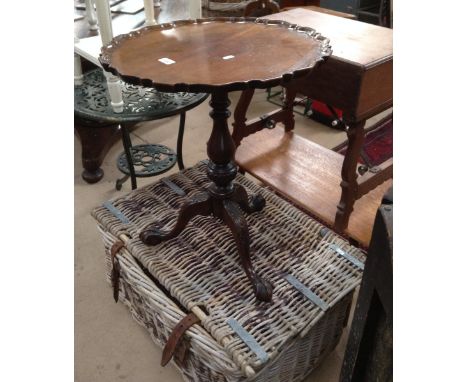 A mahogany tripod table and a vintage wicker hamper