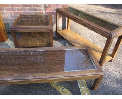 An American walnut coffee table with a glass top, a matching two tier side table and a matching two tier lamp table 