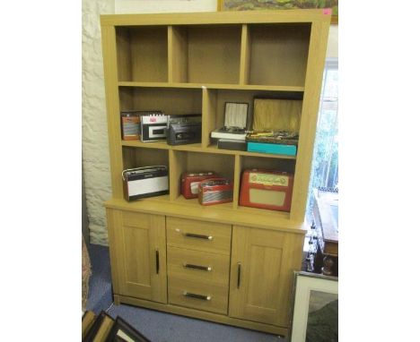 A modern light wood display cabinet with open shelves to the top and drawers and cupboards, below, 73"h x 48"w 