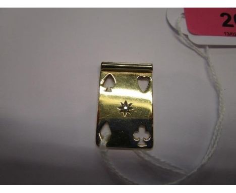A 9ct gold and yellow metal pendant in the form of a playing card, inset with a small diamond, total weight, 4.86g 