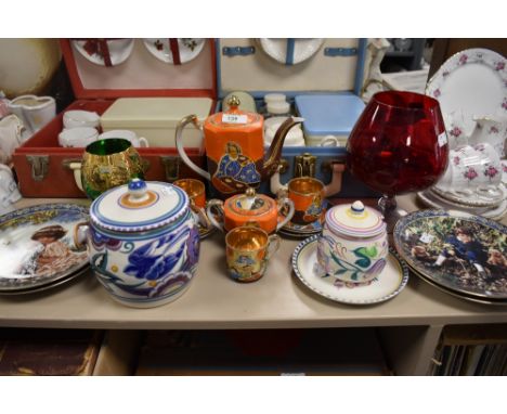 A small lot containing Poole pottery biscuit barrel , condiment pot and plate, also a part coffee set, plates and more.
Condi