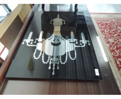 A mirrored wall hanging, depicting chandelier , approx. dimensions 70 x 50cm