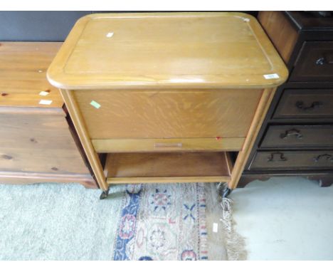 A vintage golden oak sewing trolley and contents, approx. width 62cm