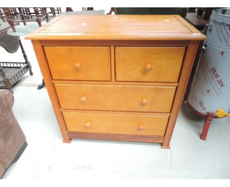A modern light wood two over two bedroom chest, having self soft closing drawers, approx. Width 90cm, depth 52cm, height 90cm