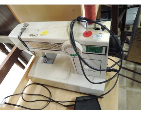 A Toyota sewing machine and tapestry frame. Model 2260&nbsp; &nbsp;EC1 series