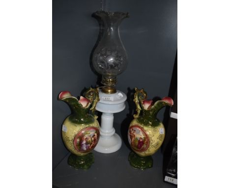 Two ceramic mantel urns and an oil lamp having fluted glass chimney.
Condition Report good condition witth light crazing to t