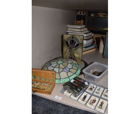 A selection of items, including tiffany style lamp shade, cigarette cards, coins and a set of vintage jewellers weights.