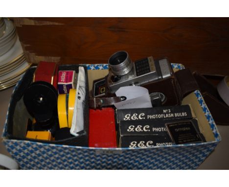 An interesting box containing  a vintage Brownie' Eight-58 projector and projector components including photo flash bulbs and