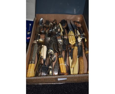 A box full of mixed vintage cutlery, various items and styles.
