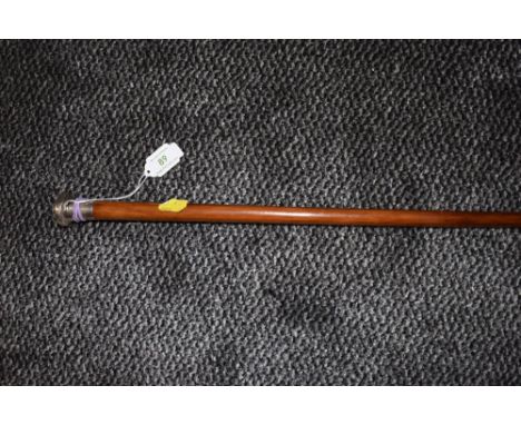 A wooden walking cane or swagger stick having hallmarked silver top.
Condition Report. some dents to knop but overall good co