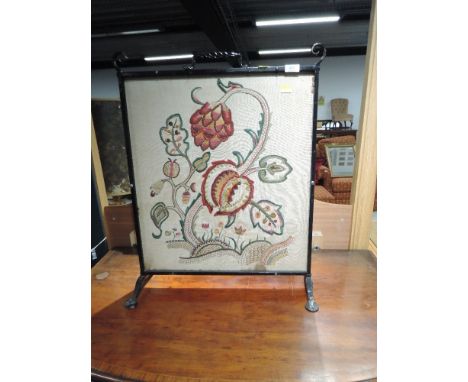 A wrought iron firescreen with tapestry inset, approx. width 54cm
