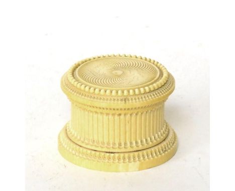 An ivory box and cover, early 19th century, of circular form with engine turned decoration, 9cm diameter