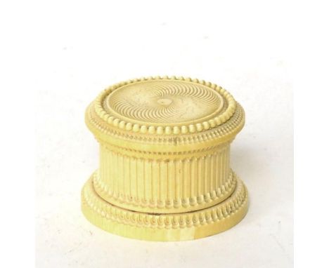 An ivory box and cover, early 19th century, of circular form with engine turned decoration, 9cm diameter