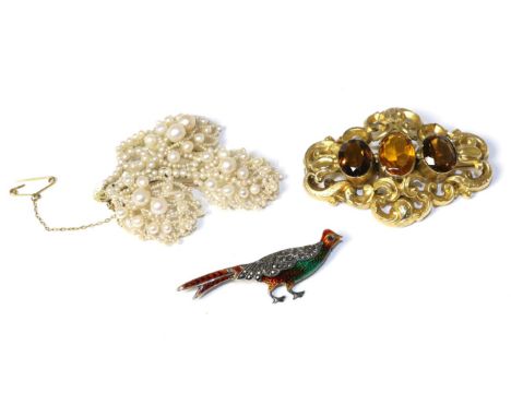 A mother-of-pearl and pearl spray brooch, a Victorian orange paste set brooch and an enamel and marcasite set pheasant brooch