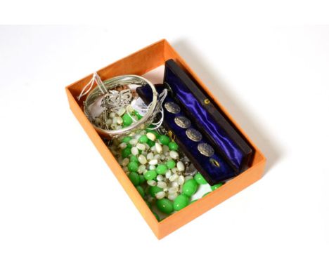 A cased set of silver Art Nouveau buttons by Henry Matthews, a silver bangle, a silver necklace, a green glass bead necklace 