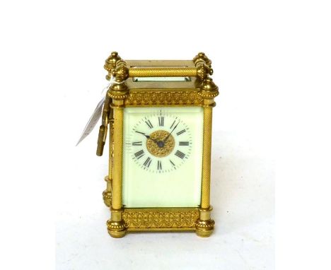 A brass carriage timepiece, movement back plate stamped R & Co, made in Paris 