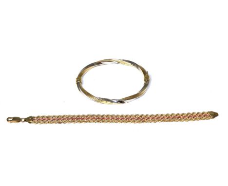 A 9 carat two colour gold bangle and a 9 carat gold bracelet (2) Bangle - 7.33g gross. Bracelet - 6.72g gross. 