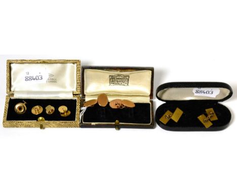 A pair of 9 carat gold engine turned double oval cufflinks, a matched set of dress studs and a pair of metal cufflinks15.6g g