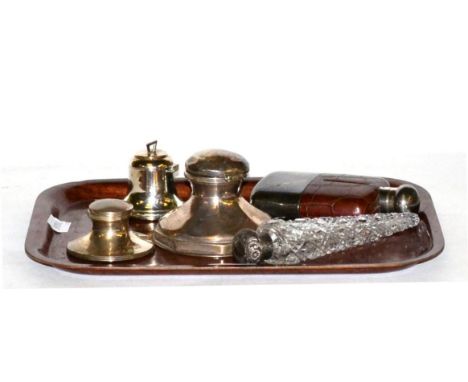 Three silver inkwells, including one in the form of a bell; a silver topped scent bottle; and a leather and silver plated hip