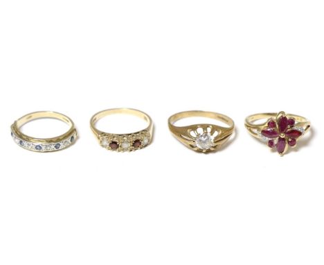 A 9 carat gold ruby cluster ring and three 9 carat gold rings (4) Cluster ring - FInger size R, 3.10g gross. Three rings - Fi
