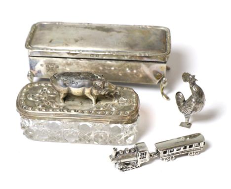 A silver topped cut glass box with novelty silver pin cushion top modelled as a pig, marks partially rubbed, either 1905 or 1