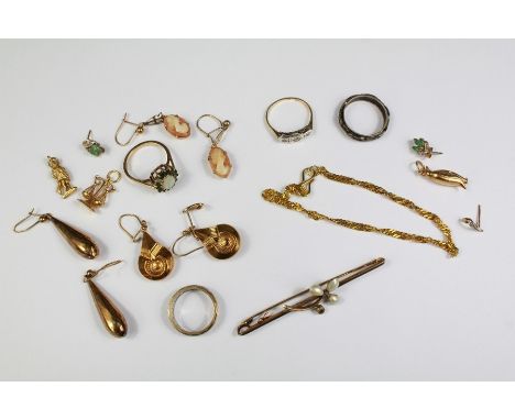 Miscellaneous 9ct Gold Jewellery. This lot includes three pairs of earrings, three 9ct gold charms (penguin, justice scales a