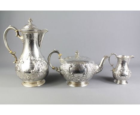 A Victorian Silver Tea Trio. The set comprising tea pot, milk jug and water jug, Sheffield hallmark, mm Martin Hall & Co, dat