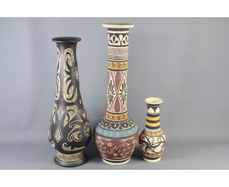 Four Malaysian Ceramic Vases. The vases hand painted with geometric pattern, the first approx 72 cms h, the second approx 65 