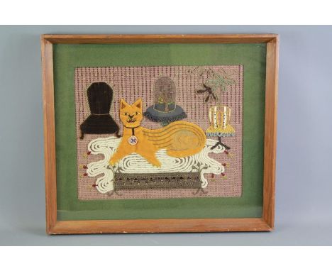 An Applique Embroidery of a Ginger Cat. The cat having gold beaded eyes and a pearl necklace resting on a cream rug, approx 3