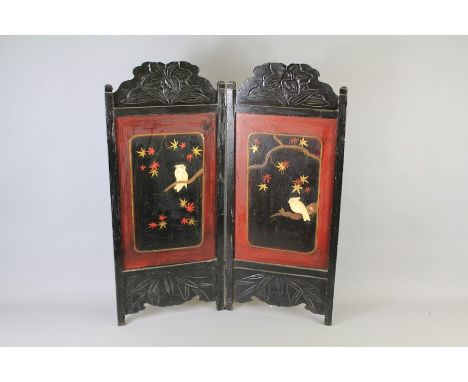 A Japanese Carved Rosewood Firescreen. The screen worked with bone depicting parrots seated on branches, approx 64 x 76 cms.