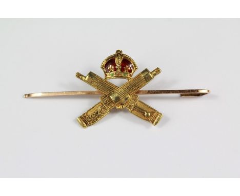 A 14ct Yellow Gold and Enamel Machine Gun Corps Brooch. The brooch on a 15 ct gold pin (af), approx 4.6 gms.