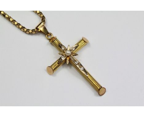 An 18ct Yellow Gold Cross Pendant. The cross with white stone and pearl decoration, approx 41 x 28mm and 3.5 gms on a 14ct go