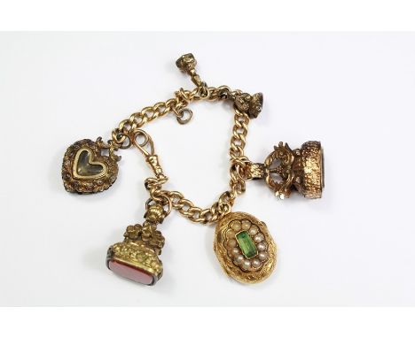 Antique 15ct Yellow Gold Charm Bracelet. The bracelet having two large and two miniature 14ct (tested) fobs, a heart-shaped c