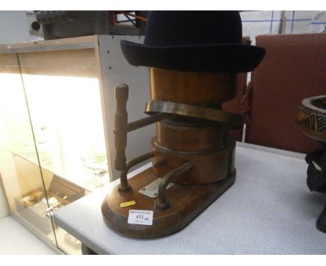 vintage wooden hat stretcher and hat