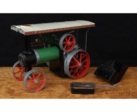 A Mamod TE1A live steam tractor, green body with cream canopy, red spoked wheels and flywheel, unboxed with scuttle piece and