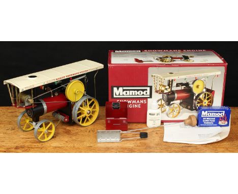 A Mamod live steam Showmans engine, maroon body with cream canopy, yellow spoked wheels and yellow flywheel, boxed with steer