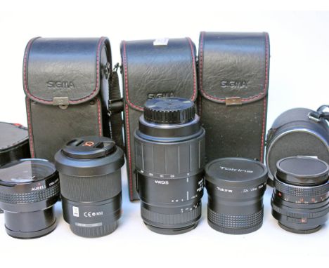 A quantity of camera lenses with associated cases.
